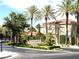 Attractive community entrance with palm trees at 1813 Francisco Peak Pl, Las Vegas, NV 89128