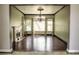 Formal dining room with hardwood floors, fireplace, and large windows at 1813 Francisco Peak Pl, Las Vegas, NV 89128