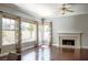 Gathering room with hardwood floors, fireplace, and large windows at 1813 Francisco Peak Pl, Las Vegas, NV 89128