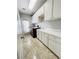 Bright laundry room with white cabinets and new washer/dryer at 1813 Francisco Peak Pl, Las Vegas, NV 89128