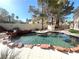 Relaxing kidney-shaped pool with waterfall feature at 1813 Francisco Peak Pl, Las Vegas, NV 89128