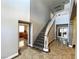 Grand staircase with dark wood steps and white railing at 1813 Francisco Peak Pl, Las Vegas, NV 89128