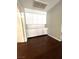 Ample storage with white cabinets and dark wood floors at 1813 Francisco Peak Pl, Las Vegas, NV 89128