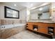 Spa-like bathroom featuring a soaking tub and double vanity at 2000 Fashion Show Dr # 2615, Las Vegas, NV 89109