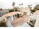 Landscaped backyard with a covered patio and hot tub at 2000 White Falls St, Las Vegas, NV 89128