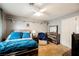 Bedroom with teal bedding, ceiling fan, and dresser at 2000 White Falls St, Las Vegas, NV 89128