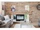 Stone fireplace in living room with recessed shelving at 2000 White Falls St, Las Vegas, NV 89128