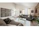 Living room with stone fireplace and high ceilings at 2000 White Falls St, Las Vegas, NV 89128