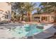 Backyard pool and hot tub surrounded by palm trees offering a private outdoor oasis at 2000 White Falls St, Las Vegas, NV 89128