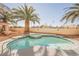 Backyard pool and hot tub surrounded by palm trees offering a private outdoor oasis at 2000 White Falls St, Las Vegas, NV 89128