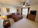 Spacious bedroom with ceiling fan and large window at 2076 Mesquite Ln # 302, Laughlin, NV 89029