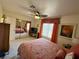 Spacious bedroom with mirrored closet doors and a ceiling fan at 2076 Mesquite Ln # 302, Laughlin, NV 89029