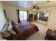 Well-lit bedroom with mirrored closet doors and window at 2076 Mesquite Ln # 302, Laughlin, NV 89029