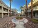 Courtyard view of the apartment building with landscaping and walkways at 2076 Mesquite Ln # 302, Laughlin, NV 89029