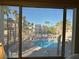 View of a community pool and surrounding buildings from a window at 2076 Mesquite Ln # 302, Laughlin, NV 89029