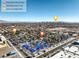 Aerial view of community, tennis court, and Las Vegas Strip at 2132 Petersham Ct # D, Las Vegas, NV 89108