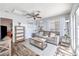 Living room with gray couch and wood flooring, access to bedroom at 2132 Petersham Ct # D, Las Vegas, NV 89108