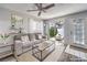 Living room with gray couch, wood floors, and access to a patio at 2132 Petersham Ct # D, Las Vegas, NV 89108