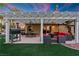 Relaxing backyard patio with pergola, seating area, and built-in grill at 2228 Lucerne Ct, Henderson, NV 89014