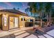 Outdoor kitchen, pergola, and seating area with artificial turf at 2228 Lucerne Ct, Henderson, NV 89014