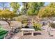 Peaceful backyard pond with waterfall feature and stone pathway at 2228 Lucerne Ct, Henderson, NV 89014