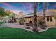 Landscaped backyard with spa, gazebo, and artificial turf at 2228 Lucerne Ct, Henderson, NV 89014