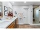 Elegant bathroom with double vanity and a walk in shower at 2228 Lucerne Ct, Henderson, NV 89014