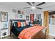 Bedroom with a dark wood sleigh bed and orange bedding at 2228 Lucerne Ct, Henderson, NV 89014