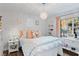 Bedroom with a floral comforter and a white and pink color scheme at 2228 Lucerne Ct, Henderson, NV 89014