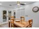 Charming dining area features wooden table and view of the patio at 2228 Lucerne Ct, Henderson, NV 89014