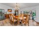 Formal dining room with hardwood floors, a large table, and wine storage at 2228 Lucerne Ct, Henderson, NV 89014