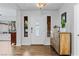 Bright entryway with wood-look floors, white door, and decorative console table at 2228 Lucerne Ct, Henderson, NV 89014