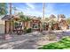 Landscaped front yard with mature trees and drought-tolerant plants at 2228 Lucerne Ct, Henderson, NV 89014