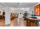 Open concept home bar with view into the dining room and kitchen area at 2228 Lucerne Ct, Henderson, NV 89014