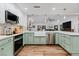 Updated kitchen with farmhouse sink and stainless steel appliances at 2228 Lucerne Ct, Henderson, NV 89014