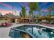 Inviting pool and spa with city views in the background at 2228 Lucerne Ct, Henderson, NV 89014