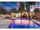 Stunning pool and spa at night with colorful lighting at 2228 Lucerne Ct, Henderson, NV 89014