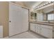 Double vanity bathroom with large mirror and tile flooring at 2245 Juniper Berry Dr, Las Vegas, NV 89134