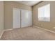 Bedroom with double door closet and window with blinds at 2245 Juniper Berry Dr, Las Vegas, NV 89134