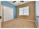 Bedroom with blue accent wall and window at 2245 Juniper Berry Dr, Las Vegas, NV 89134