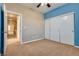 Bedroom with blue accent wall and hallway view at 2245 Juniper Berry Dr, Las Vegas, NV 89134