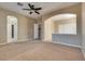 Large bedroom with carpet, ceiling fan and access to a walk-in closet at 2245 Juniper Berry Dr, Las Vegas, NV 89134