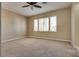 Spacious carpeted bedroom with ceiling fan and large windows at 2245 Juniper Berry Dr, Las Vegas, NV 89134