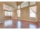 Bright living room with hardwood floors, high ceilings, and large windows at 2245 Juniper Berry Dr, Las Vegas, NV 89134