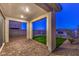 Covered patio with artificial turf and brick pavers, perfect for outdoor relaxation at 2376 Switchback Valley St, Las Vegas, NV 89138