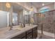 Modern bathroom with double vanity and large walk-in shower at 2376 Switchback Valley St, Las Vegas, NV 89138