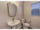 Small bathroom with pedestal sink and toilet at 2376 Switchback Valley St, Las Vegas, NV 89138