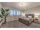 Spacious bedroom with large windows and plush carpet at 2376 Switchback Valley St, Las Vegas, NV 89138