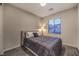 Charming bedroom with a queen-size bed and window views at 2376 Switchback Valley St, Las Vegas, NV 89138