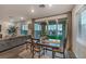 Bright dining area with sliding glass doors leading to a backyard patio at 2376 Switchback Valley St, Las Vegas, NV 89138